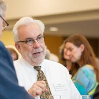 Three guests talking to each other.